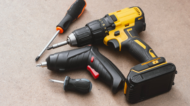 Electric screwdriver and drill displayed side-by-side.