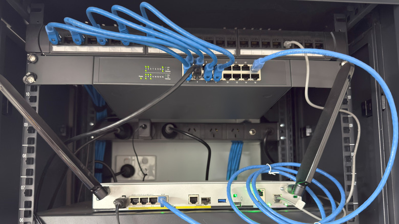 Networking setup of a switch connected to a router with an Ethernet cable running between them
