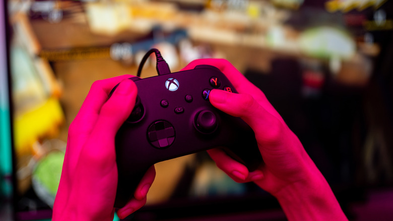 kid playing on xbox series x controller