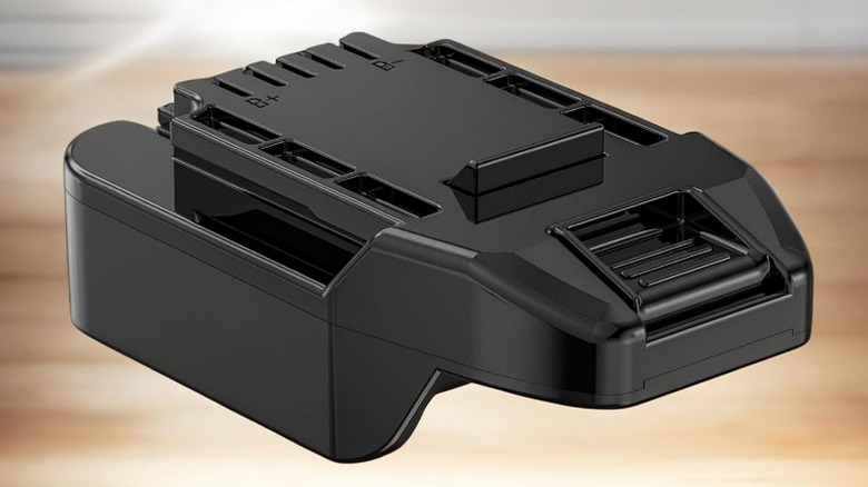 Close up of Bauer/DeWalt battery adapter on blurred background