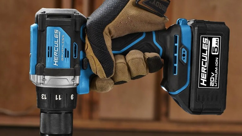 A person using a Hercules 20V drill driver