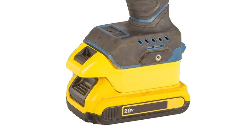 A DeWalt battery attached to a Hercules tool with an adapter