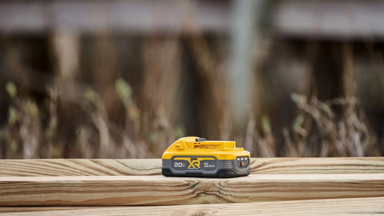 DeWalt PowerStack 20V battery on wood pallets