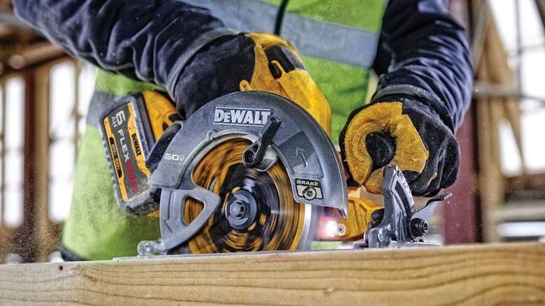 Person using DeWalt circular saw with Flexvolt battery