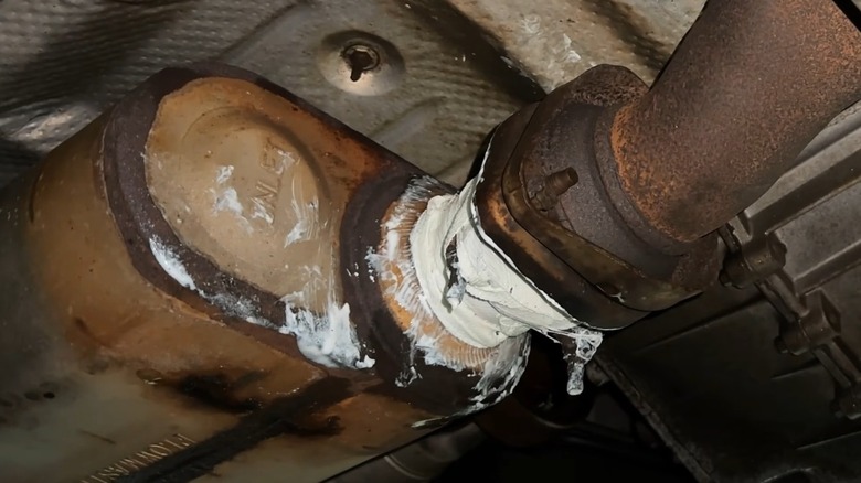 An exhaust system wrapped with J-B Weld exhaust wrap.