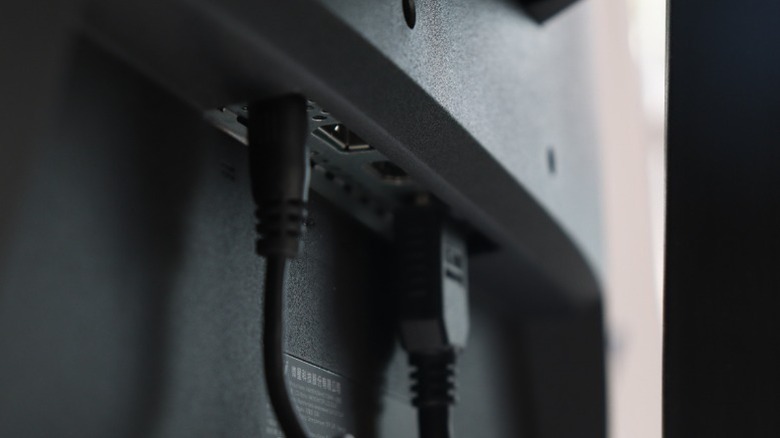 Different cables connected to a monitor