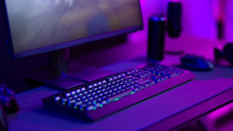A gaming setup with a monitor, keyboard, and mouse