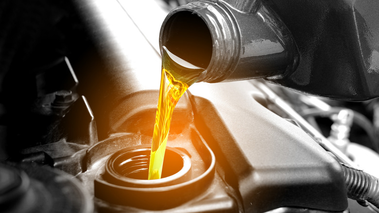 Motor oil being poured into an engine