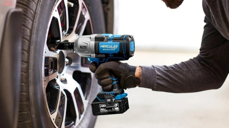 A worker using a Hercules Impact Wrench from Harbor Freight.