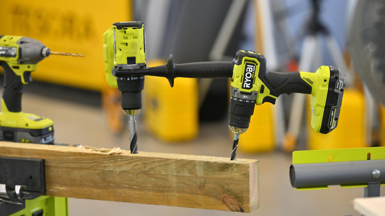A lineup of Ryobi tools on display at an unknown store