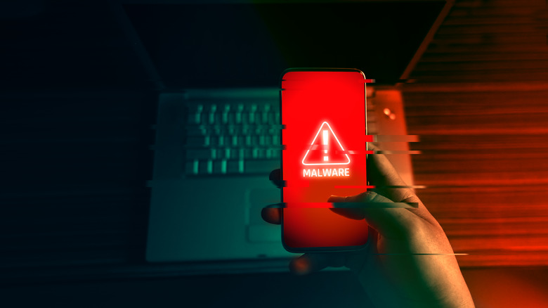 red phone screen reading "malware"