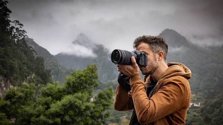 man with Canon EOS R5 C camera