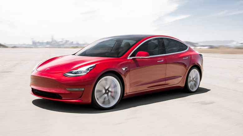 Tesla Model 3 with city in background