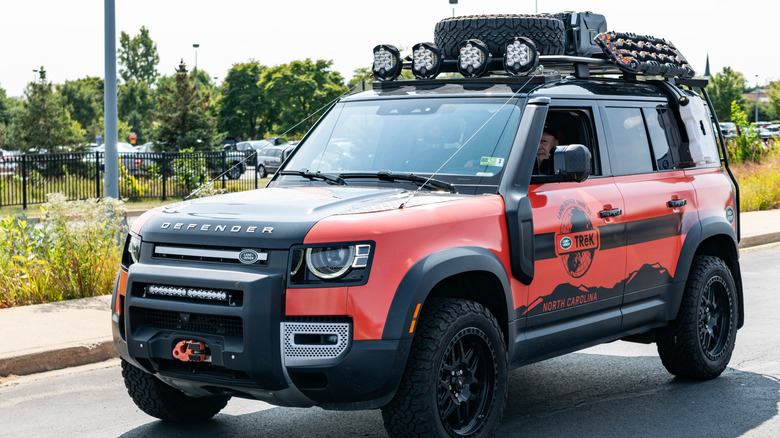 2022 Land Rover Defender vehicle, side view.