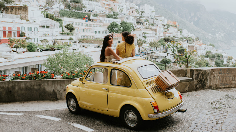 yellow fiat on clifftop
