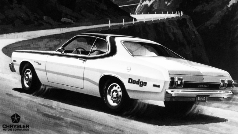 Rear 3/4 view of 1974 Dodge Dart Sport Rallye on winding uphill road in black and white