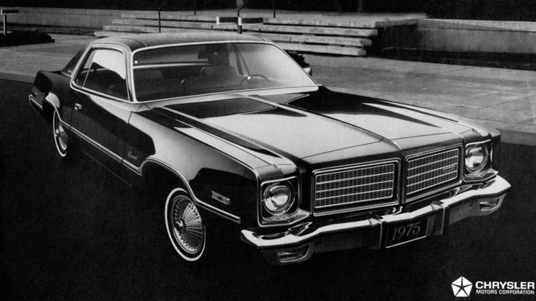 Front 3/4 view of 1975 Dodge Coronet in institutional setting in black and white