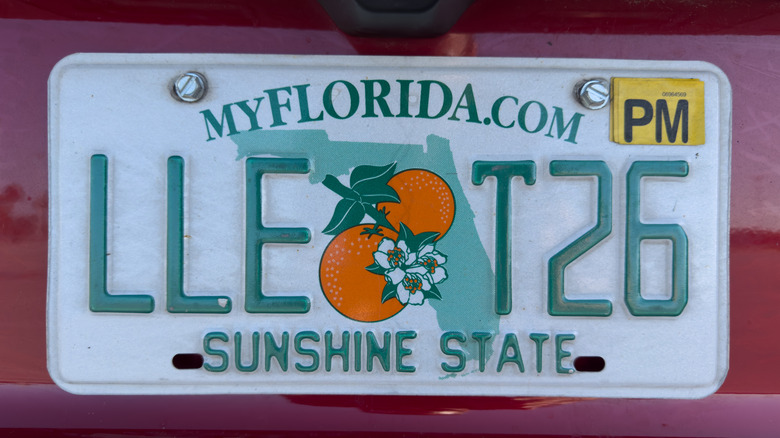 Close-up of Florida license plate with yellow registration sticker