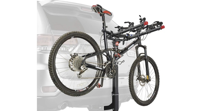 A promotional image of the Allen sports bike rack installed on a small suv