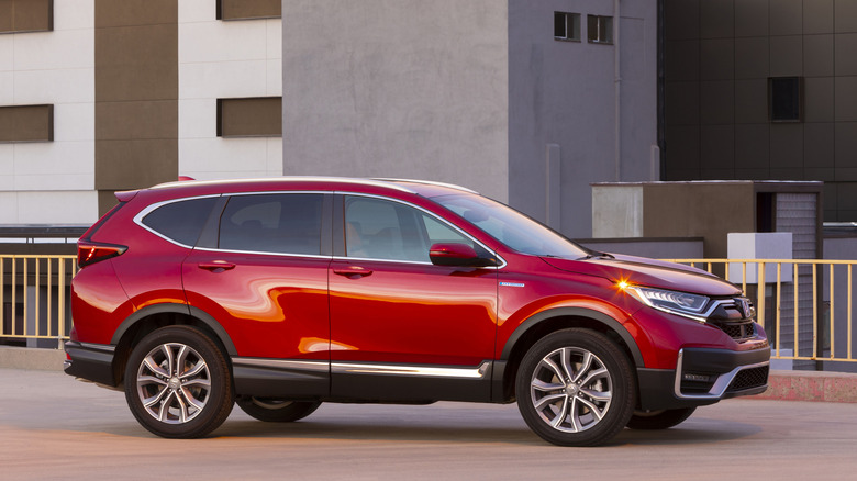 Right side view of red 2022 Honda CR-V parked on city street