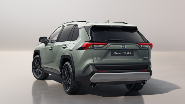 Rear view of grey Toyota RAV4 hybrid in studio