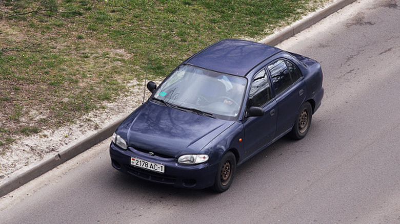Blue Hyundai Elantra on suburban road in Russia