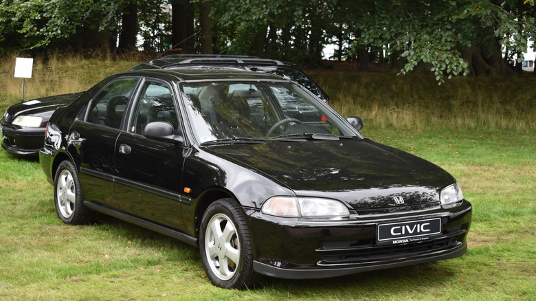 Black 2022 Honda Civic parked in grass