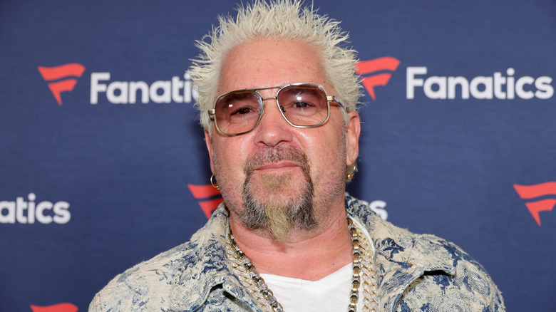 Guy Fieri smiling with sunglasses