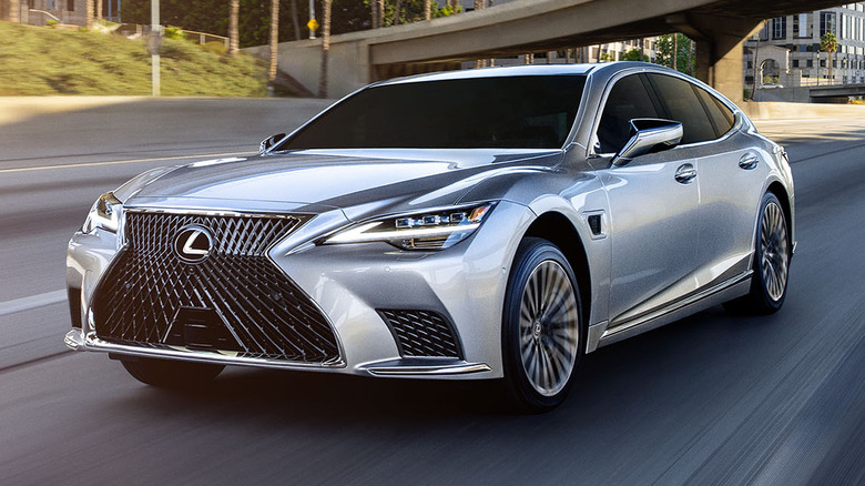 A frontal 3/4 shot of a silver Lexus LS 500h.