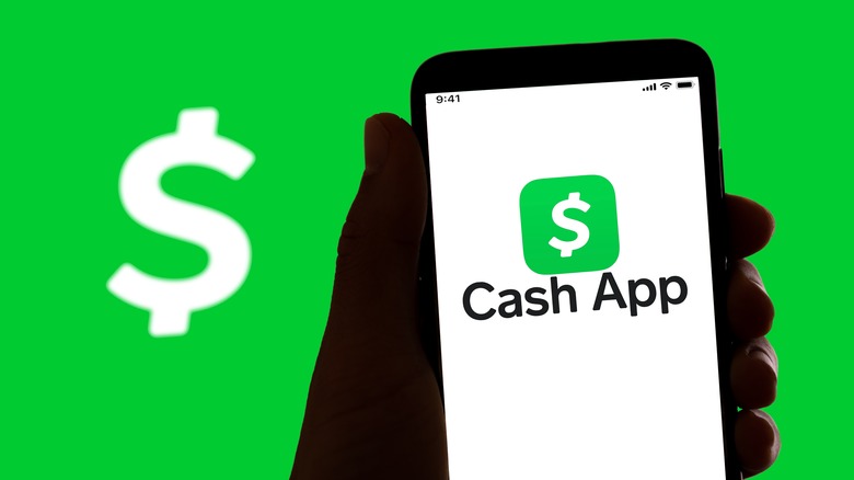 Cash App on a smartphone screen with Cash App logo in background.