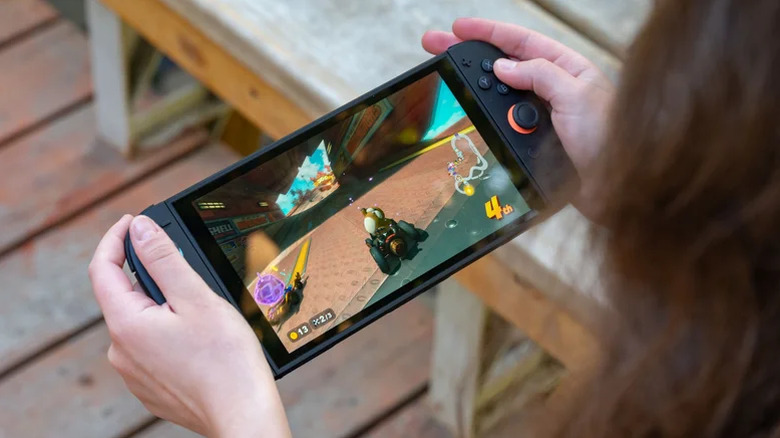 Person playing a racing game on a Switch 2