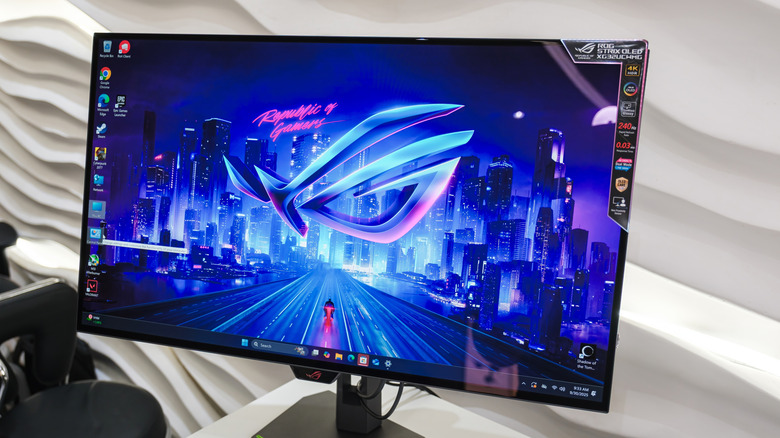 ASUS ROG Strix OLED XG32UCWMG monitor on a table