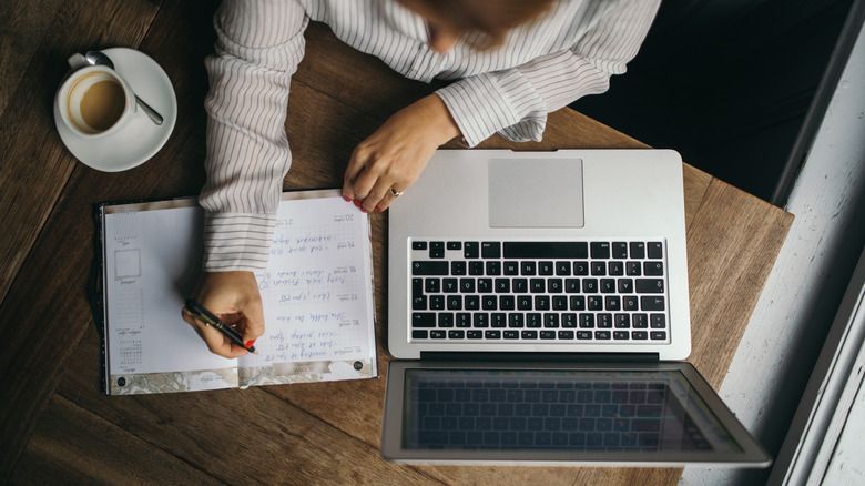 Woman writing in notebook
