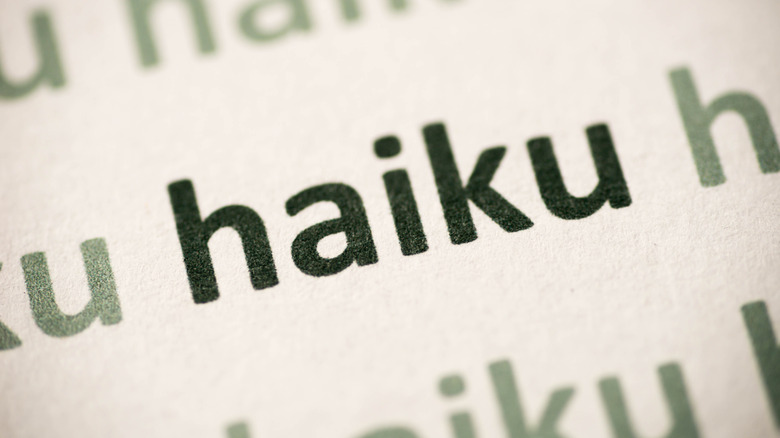 word haiku printed on white paper macro