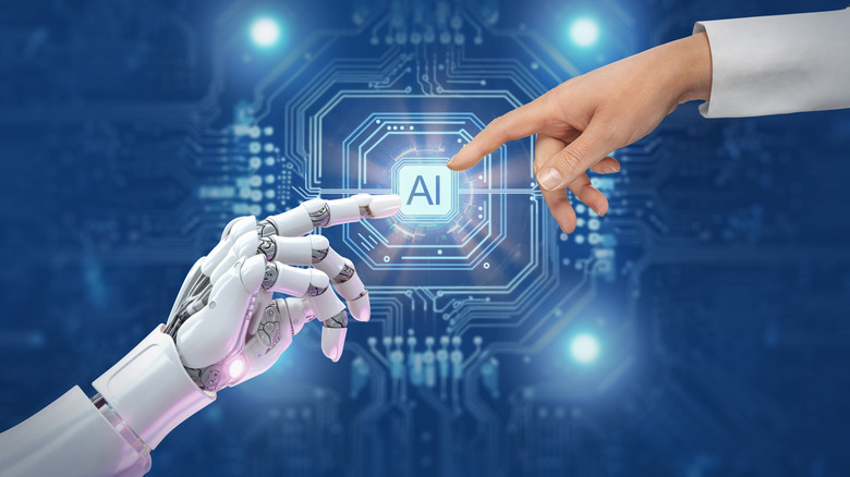 Robot and human hands touching the word AI