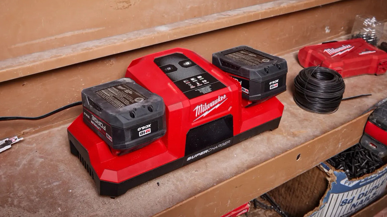 Milwaukee M18 batteries docked in a Super Charger.