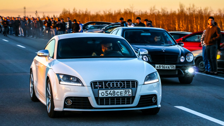 Mercedes-Benz E55 AMG racing an Audi TTS