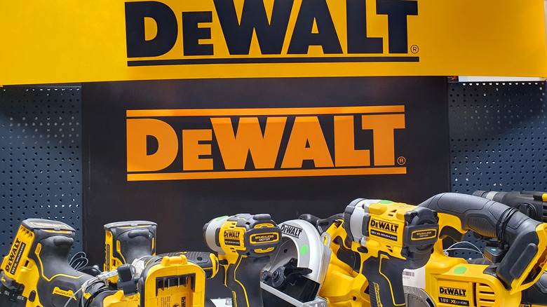 DeWalt electric tools in front of brand sign