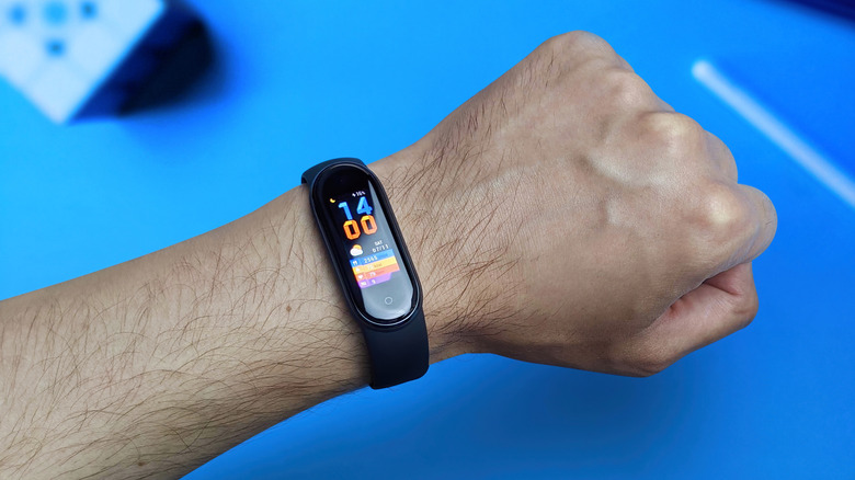 Xiaomi fitness tracker on a person's wrist