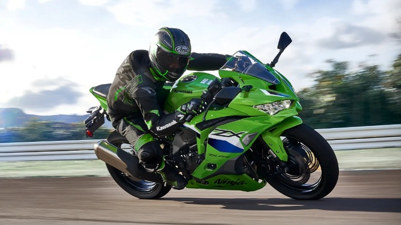 Man turning on a 2026 Kawasaki Ninja ZX-4R ABS