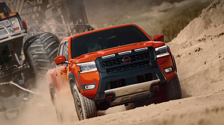 Nissan Frontier pulling a monster truck