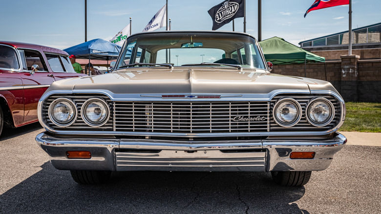 Front view of the 1964 Chevy Bel Air parked outside at a car show