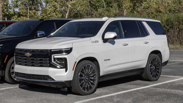 Front three-quarter view of white 2026 Chevy Tahoe parked on dealer lot.
