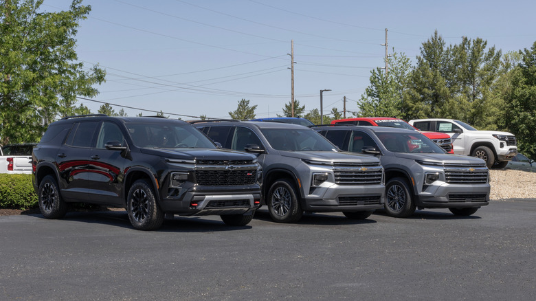 Three 2025 Chevrolet Traverse SUVs parked