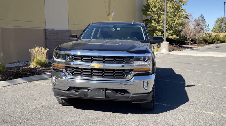 A black 2016 Chevy 1500 LT at a parking lot