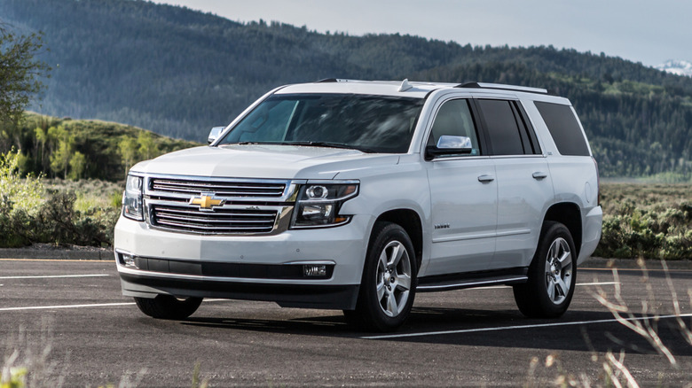 White Chevy Tahoe on country road
