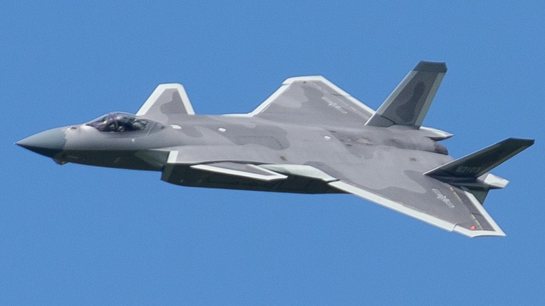A Chinese J-20 fighter jet flying at an air show in 2022