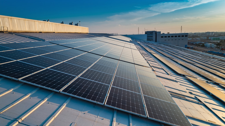 Sola panels absorb sun on rooftop of a commercial building