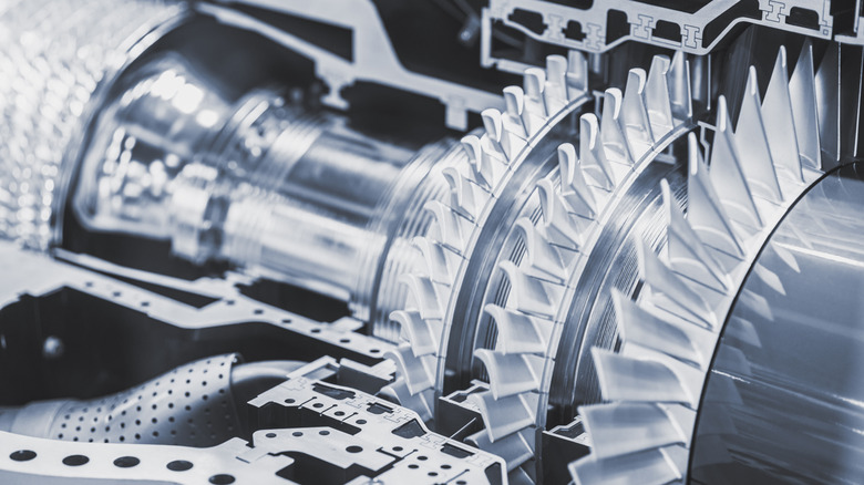The interior of a jet engine with turbine blades prominent