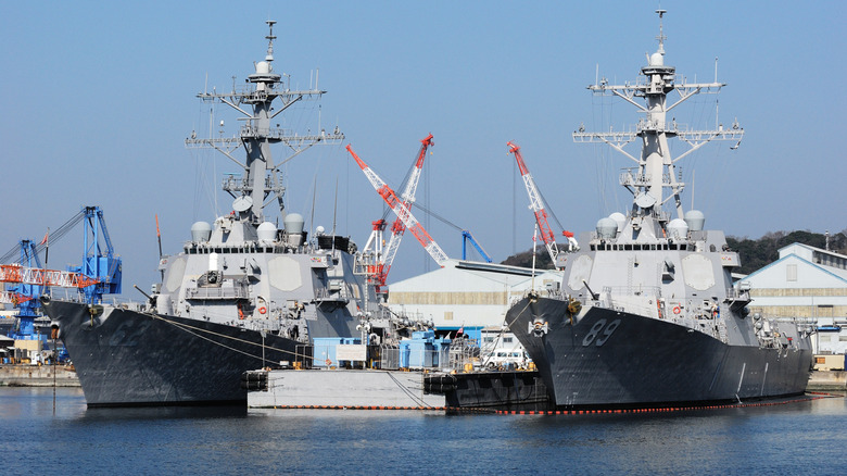 Two U.S. Navy Arleigh Burke class destroyers docked in Japan